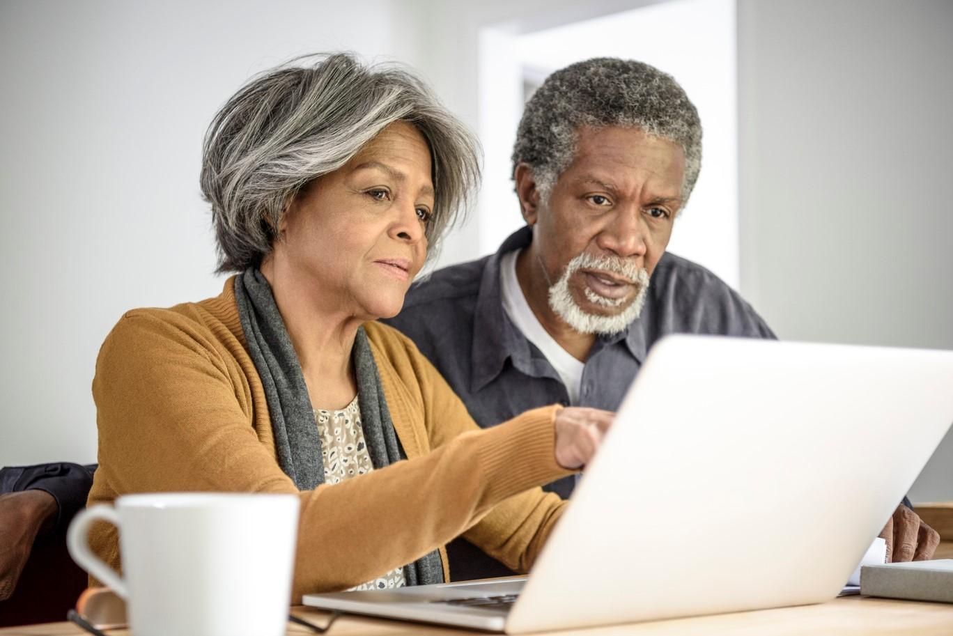 Older couple using a computer