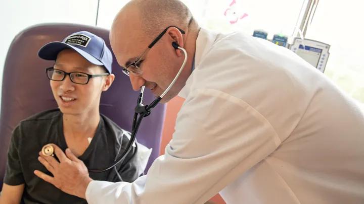 Medical professional next to patient 
