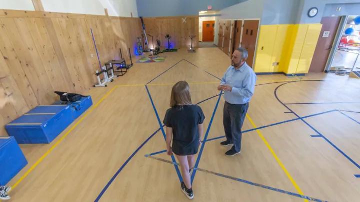 Neurologists work in exercise therapy room and gym for patients 