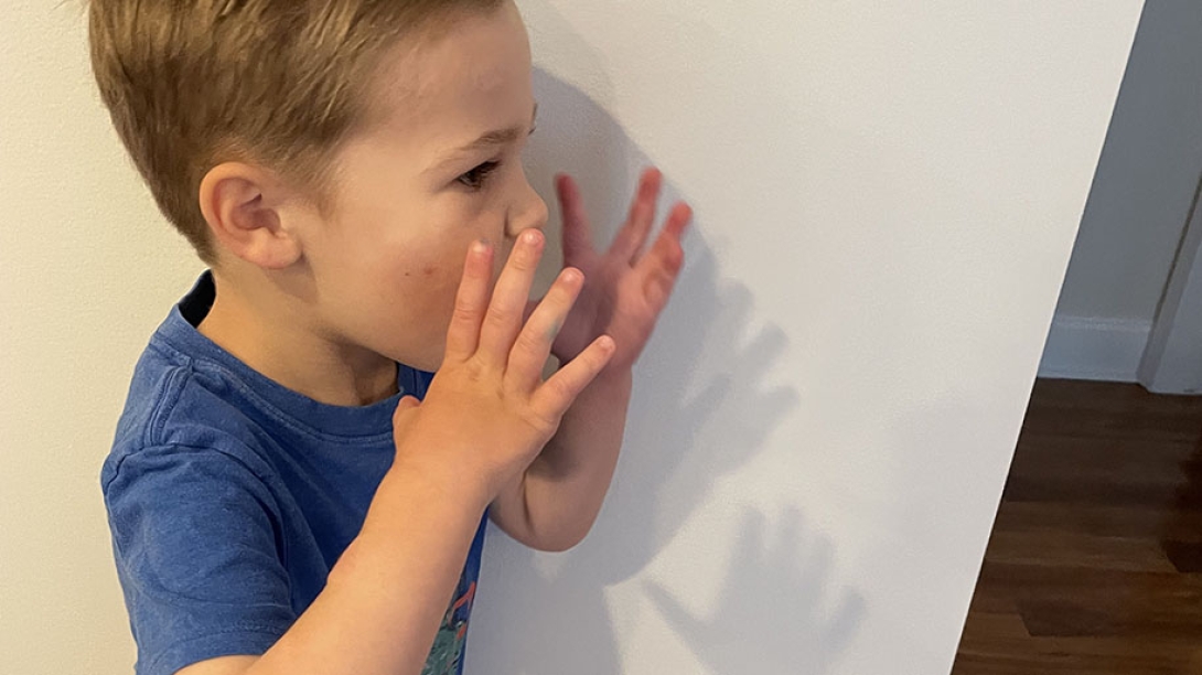 Child using hands to send his voice