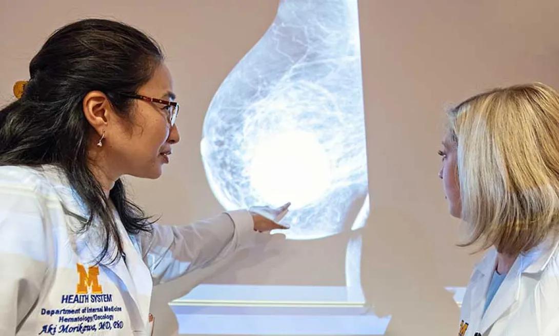 Drs. Aki Morikawa and Erin Cobain view a breast scan